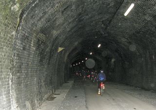 Riders in tunnel, Monsal Trail