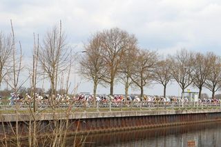 Typically for a Dutch race in this region, the peloton rides alongside a canal