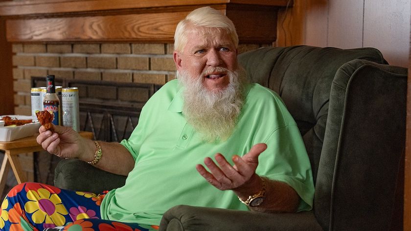 John Daly eating pizza in lime-green shirt and flowery pants in Happy Gilmore 2