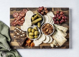 cheese and charcuterie with olives and cornichons