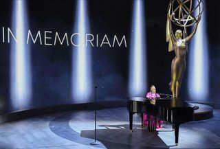H.E.R. performs during the In Memoriam segment of the 2020 Emmys.