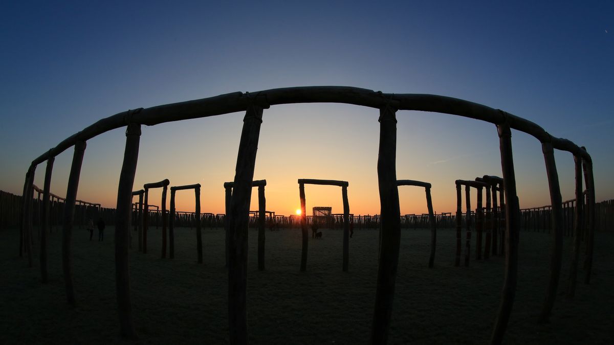 The sun rises behind the reconstructed &quot;Ringheiligtum Pömmelte&quot; in eastern Germany, on Dec. 21, 2016, the winter solstice, which is the shortest day of the year. 