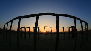 The sun rises behind the reconstructed "Ringheiligtum Pömmelte" in eastern Germany, on Dec. 21, 2016, the winter solstice, which is the shortest day of the year. 