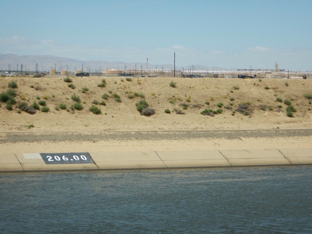 Water flows through the California Aqueduct near the Lost Hills Oil Field.