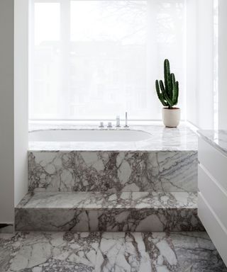 Modern bathroom with built-in marble tub