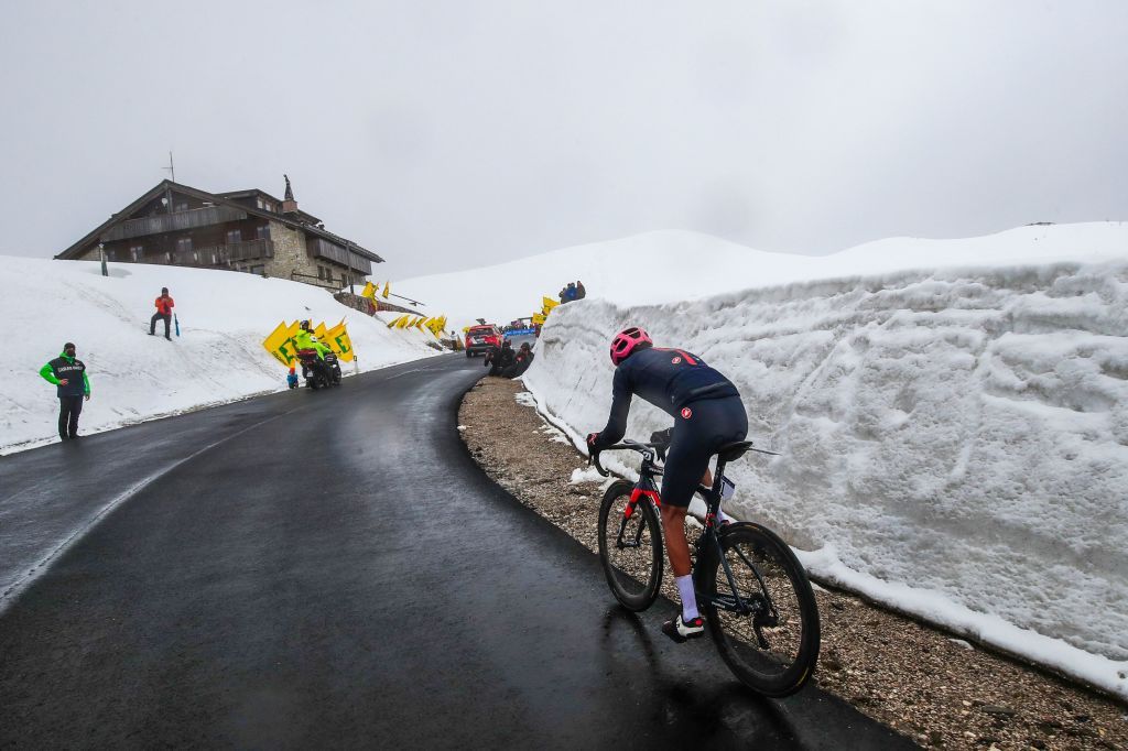 Overall leader Team Ineos rider Colombias Egan Bernal rides in the final ascent on his way to win the 16th stage of the Giro dItalia 2021 cycling race 153km between Sacile and Cortina dAmpezzo on May 24 2021 Photo by Luca Bettini AFP Photo by LUCA BETTINIAFP via Getty Images