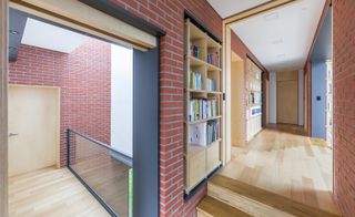 House interiors with red brick walls and wooden flooring
