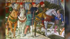 A Renaissance painting of the Medicis on horses going for a hunt. They are surrounded by people.