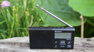 the sony xdr-p1 dab radio on a wooden table outside