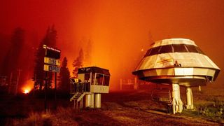 Flames surround a chair lift at Sierra-at-Tahoe Resort
