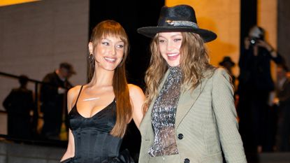 Bella Hadid (L) and Gigi Hadid attend Marc Jacobs and Char DeFrancesco's wedding reception at The Grill in Midtown on April 07, 2019 in New York City.