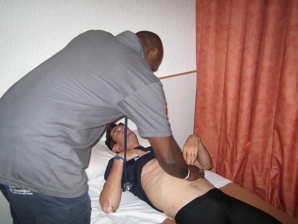 The Garmin doctor checks over Millar after the stage
