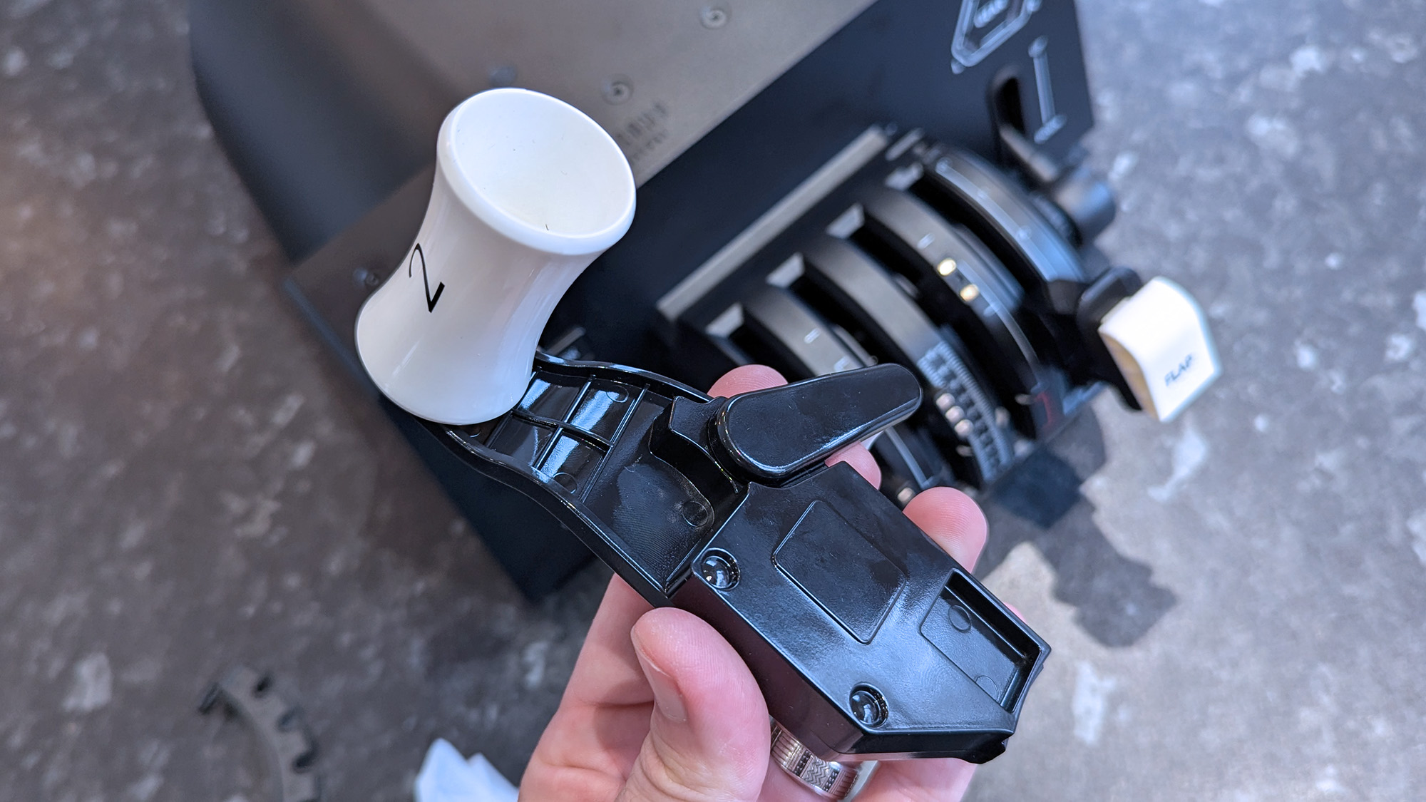 Honeycomb Aeronautical Bravo Throttle Quadrant Lite on a marble desk highlighting individual parts