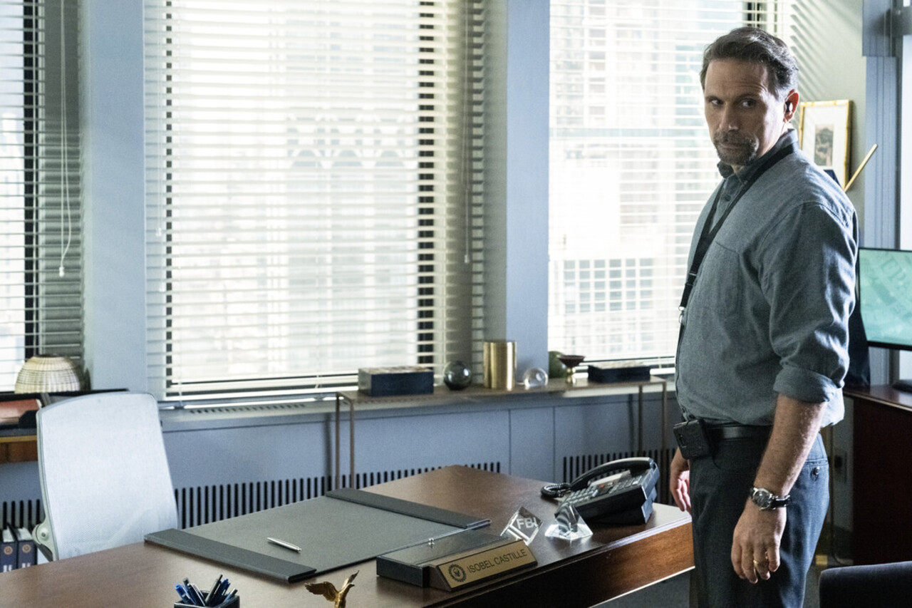Jubal standing in Isobel&#039;s empty office in FBI 801 promo pic