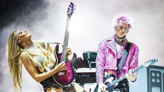 Machine Gun Kelly and Sophie Lloyd performing at Lollapalooza 2022