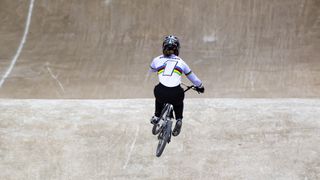 Beth Shreiver in the rainbow jersey riding her BMX in Manchester
