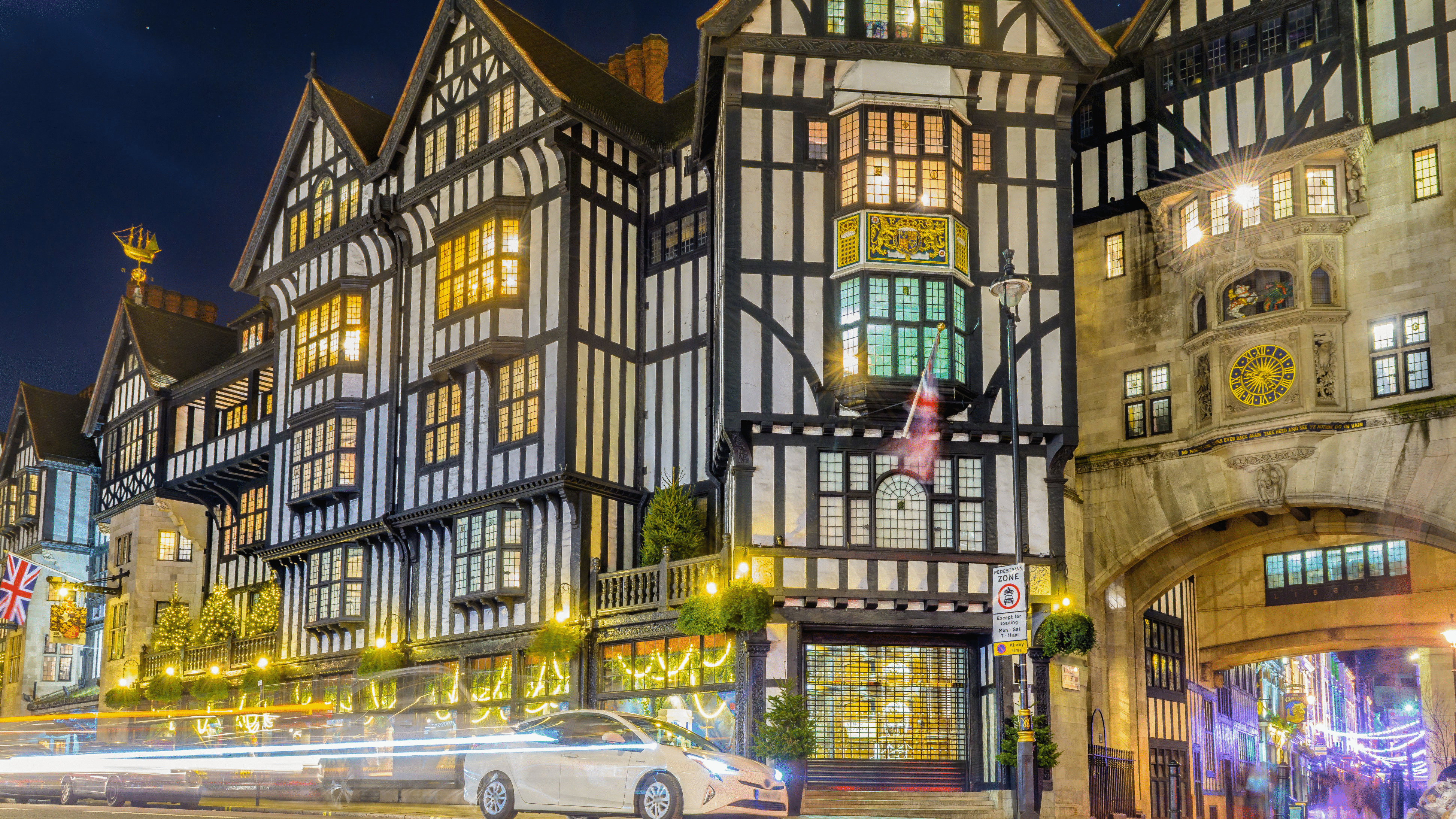 Liberty London's Tudor-revival building illuminated at night