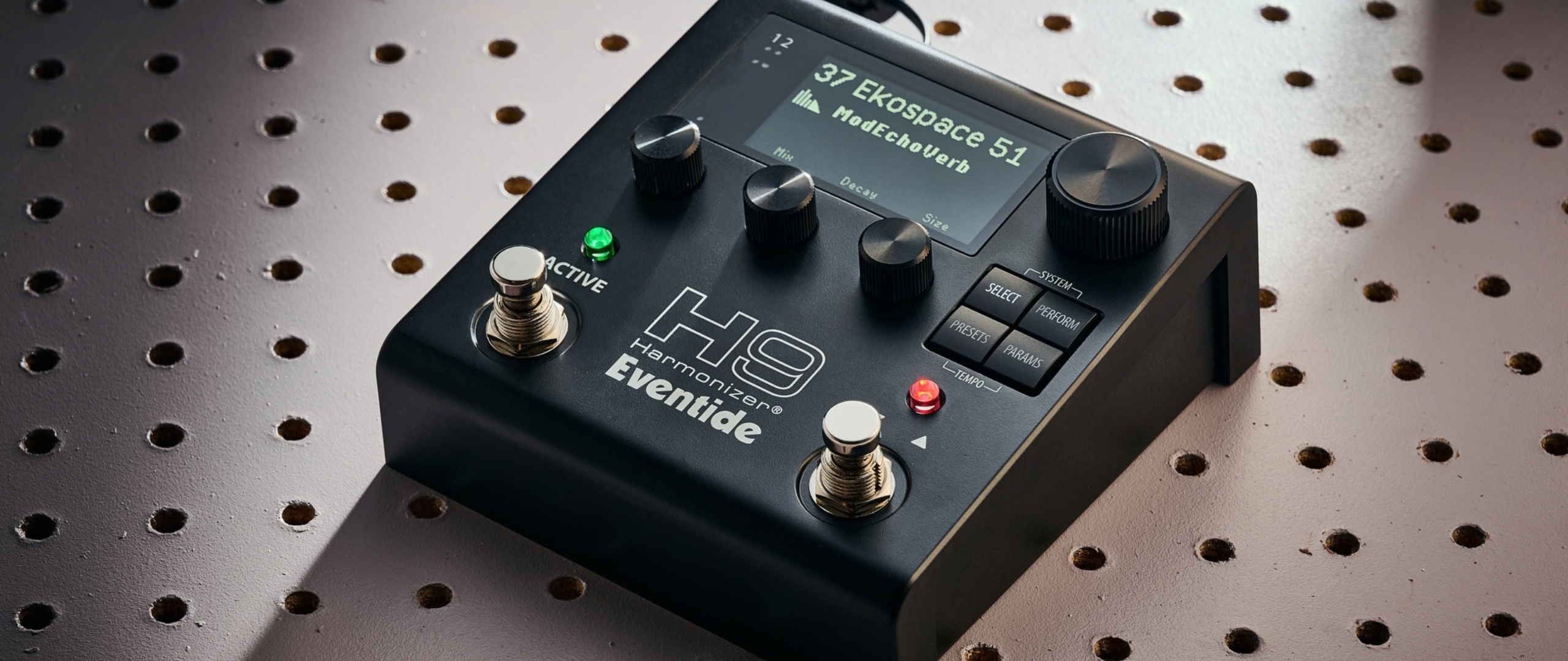An Eventide H9 Harmonizer Gen 2 multi-effects pedal on a white pegboard