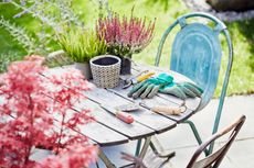 gardening gloves on an outdoor table