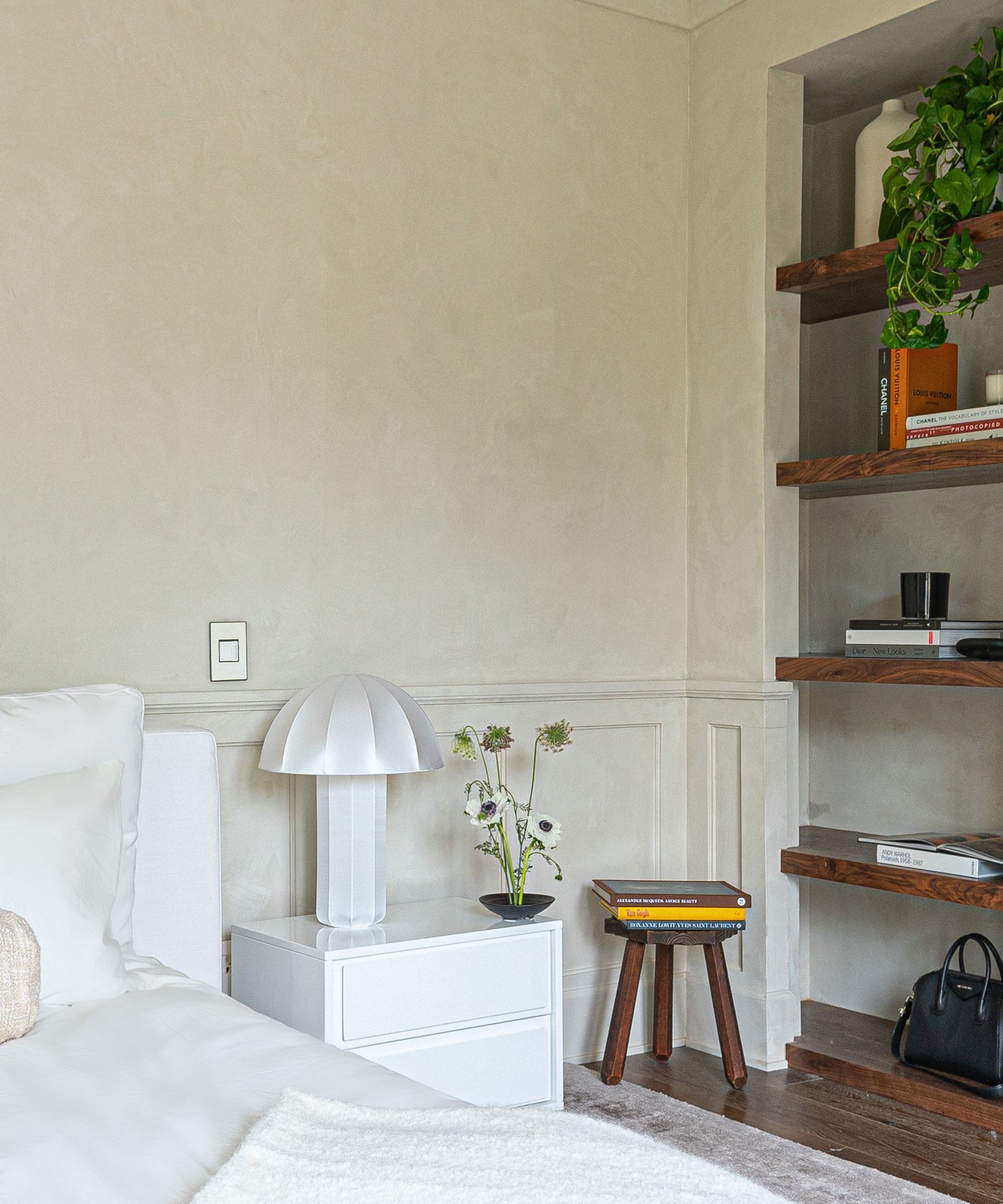 Inbuilt shelves, wooden floor, white lamp