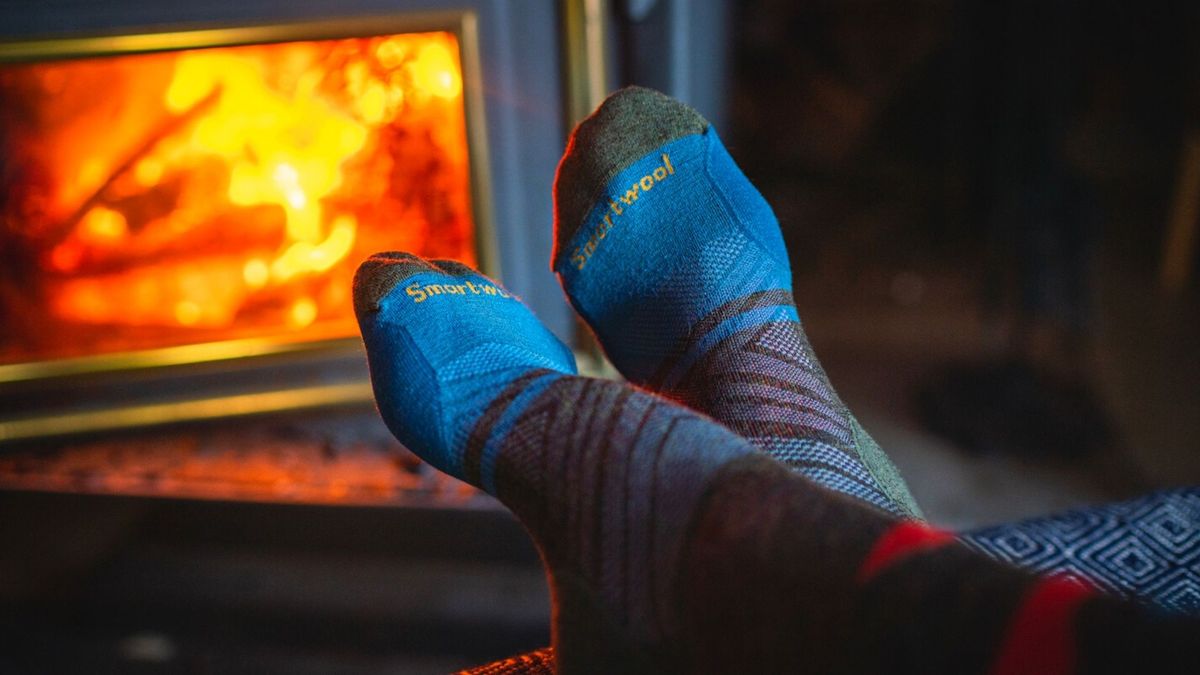 Smartwool socks by a toasty fire