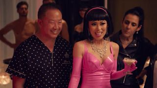 Dr. Chiu in polka dots and his wife Christine Chiu in a pink dress at a party in Bling Empire