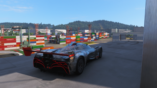 Forza Horizon 6 Tokyo City Treasure Hunt location: A Mazda Furai parked on a balcony on the side of a warehouse overlooking the docks.