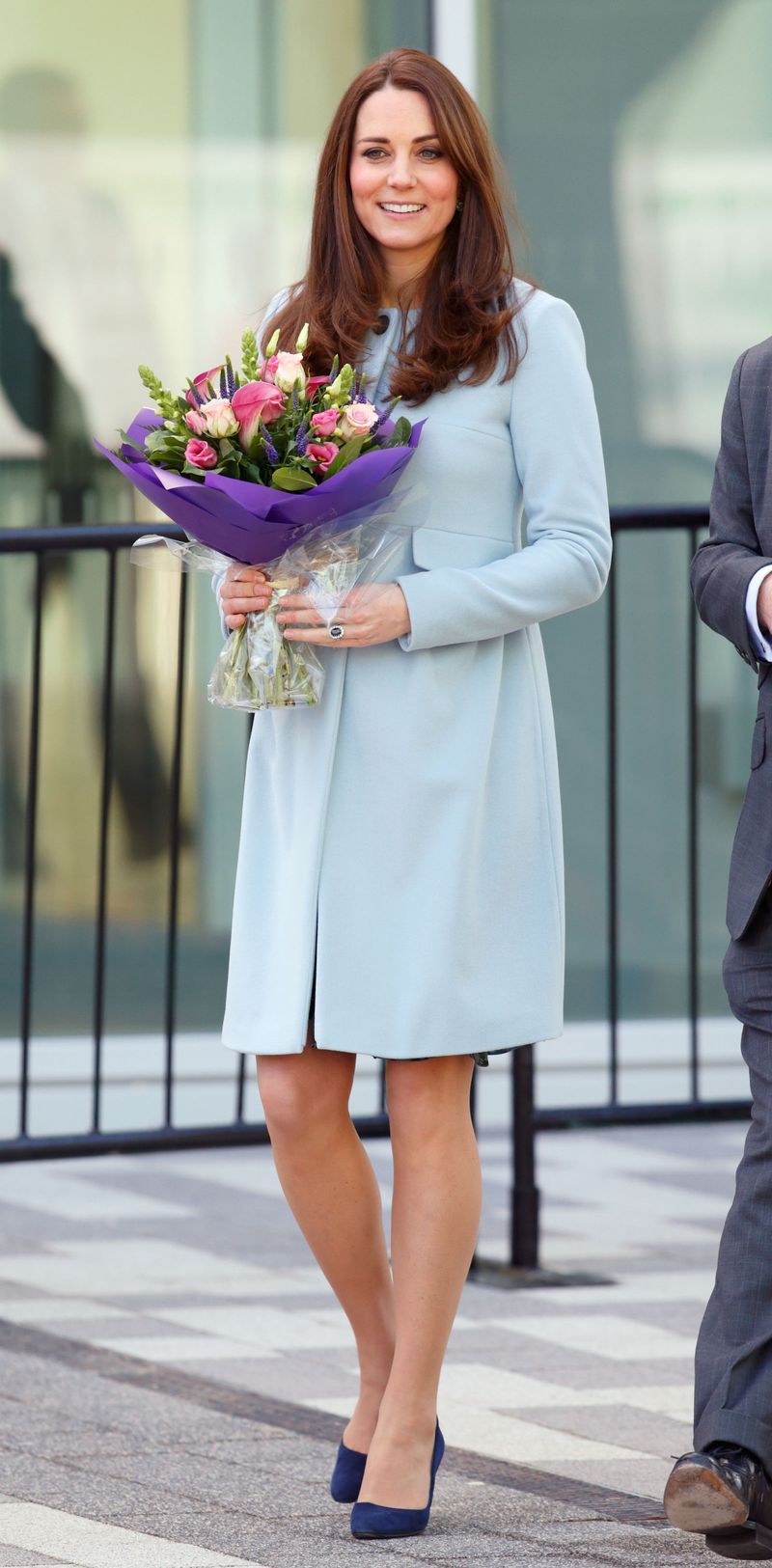 This baby blue button cashmere coat kept Middleton toasty during a day trip to Kensington Aldridge Academy.