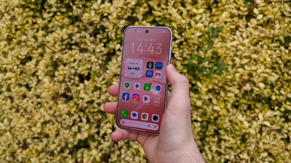 A phone against a background of yellow leaves