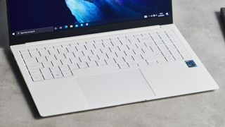 Samsung Galaxy Book Pro on wooden table and close up on the keyboard and touch pad
