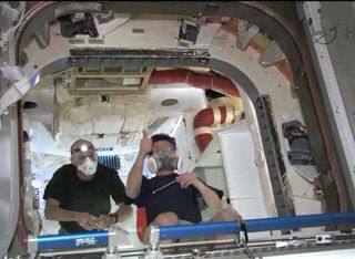 NASA astronaut Don Pettit and cosmonaut Oleg Kononenko inside Dragon on May 26, 2012.
