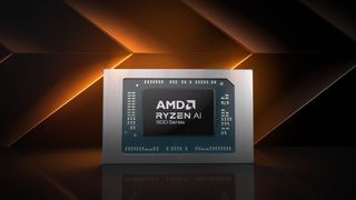 An AMD Ryzen AI 300 series chip in front of an abstract orange and black background