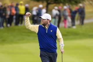 Branden Grace fist pumps at the 2015 Presidents Cup