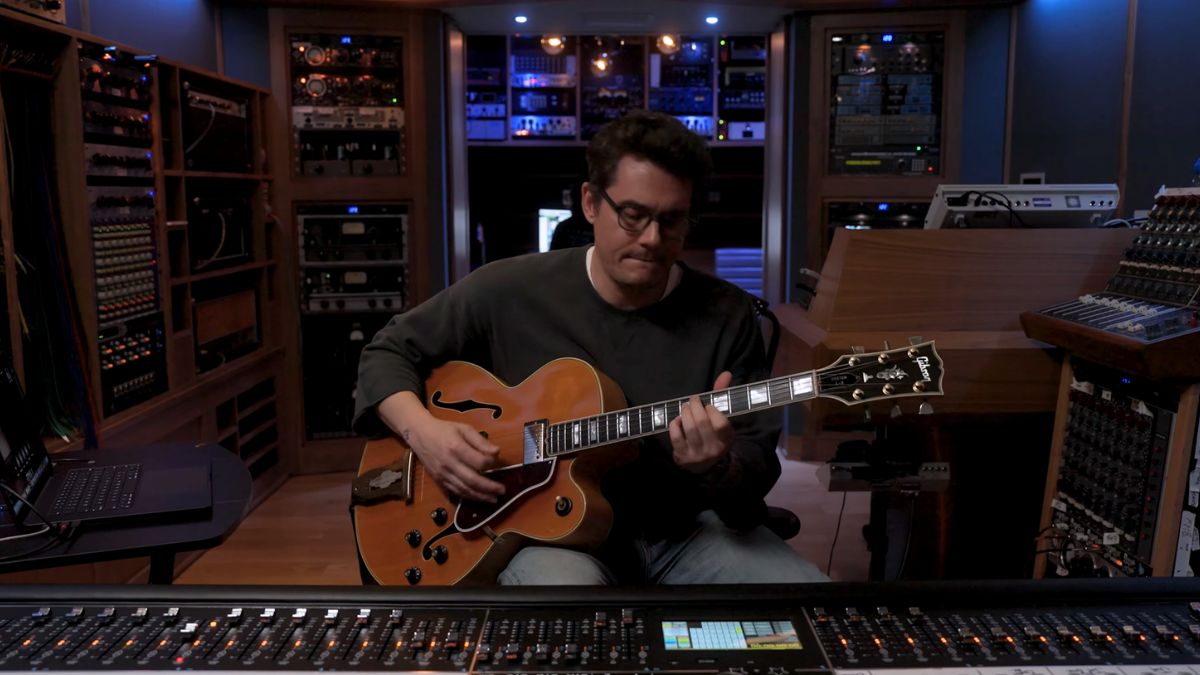 John Mayer plays a Gibson guitar in his studio