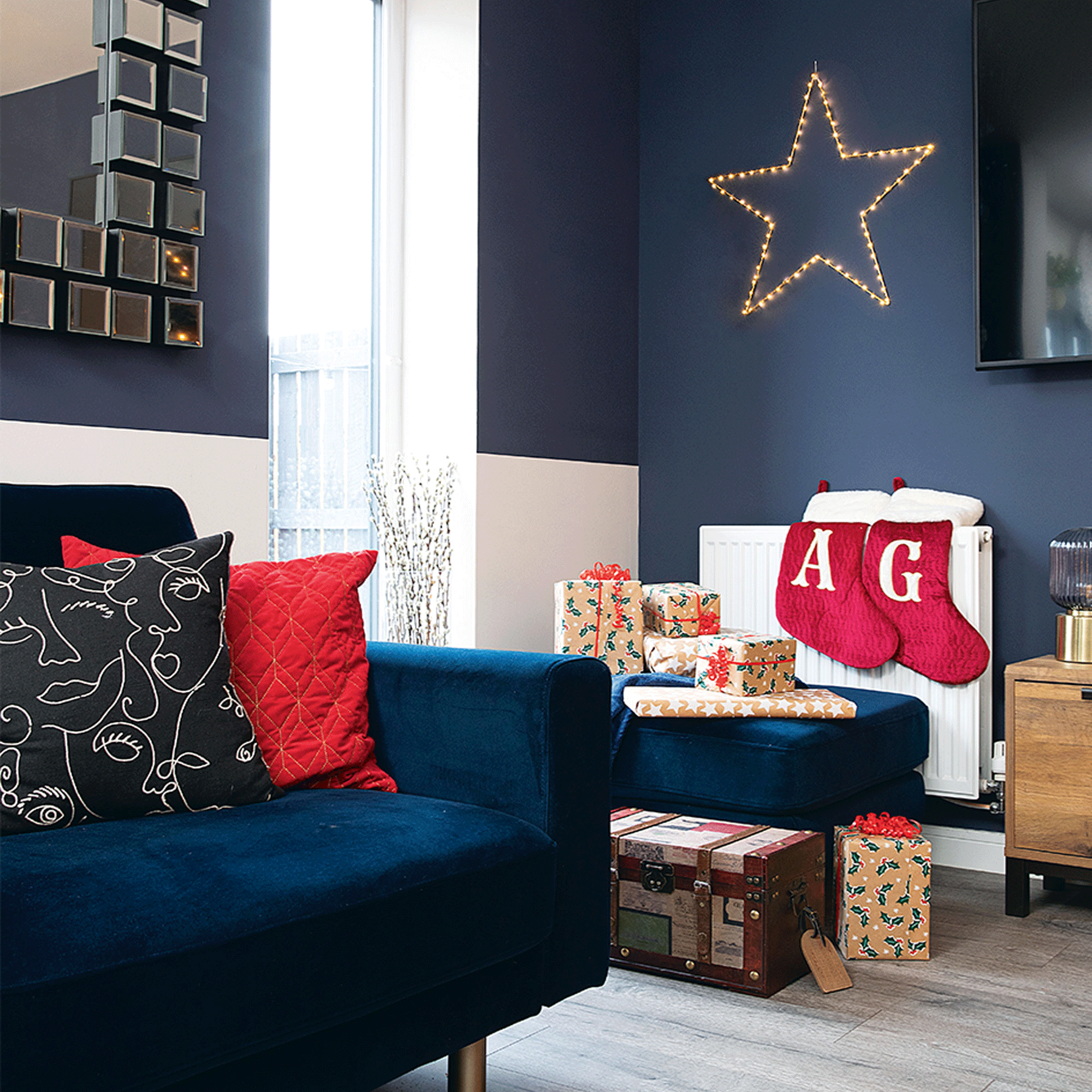 Navy blue living room with red stockings