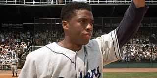 Chadwick Boseman as Jackie Robinson on the field in 42
