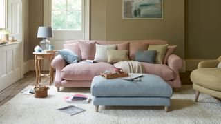 living room with pastel sofa and armchair