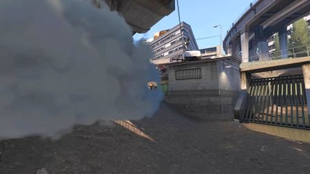 One Counter-Strike 2 player creates an opening in a smoke cloud to gun down a foe
