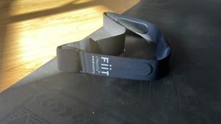 Close up of Fiit tracker on a yoga mat