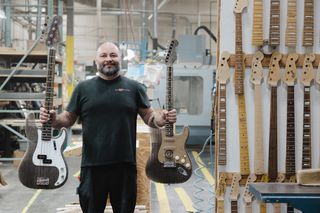 Fender Custom Shop Master Builder Paul Waller with his cardboard Fender Strat and P-Bass creations