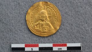 A gold coin depicting Jesus Christ. 