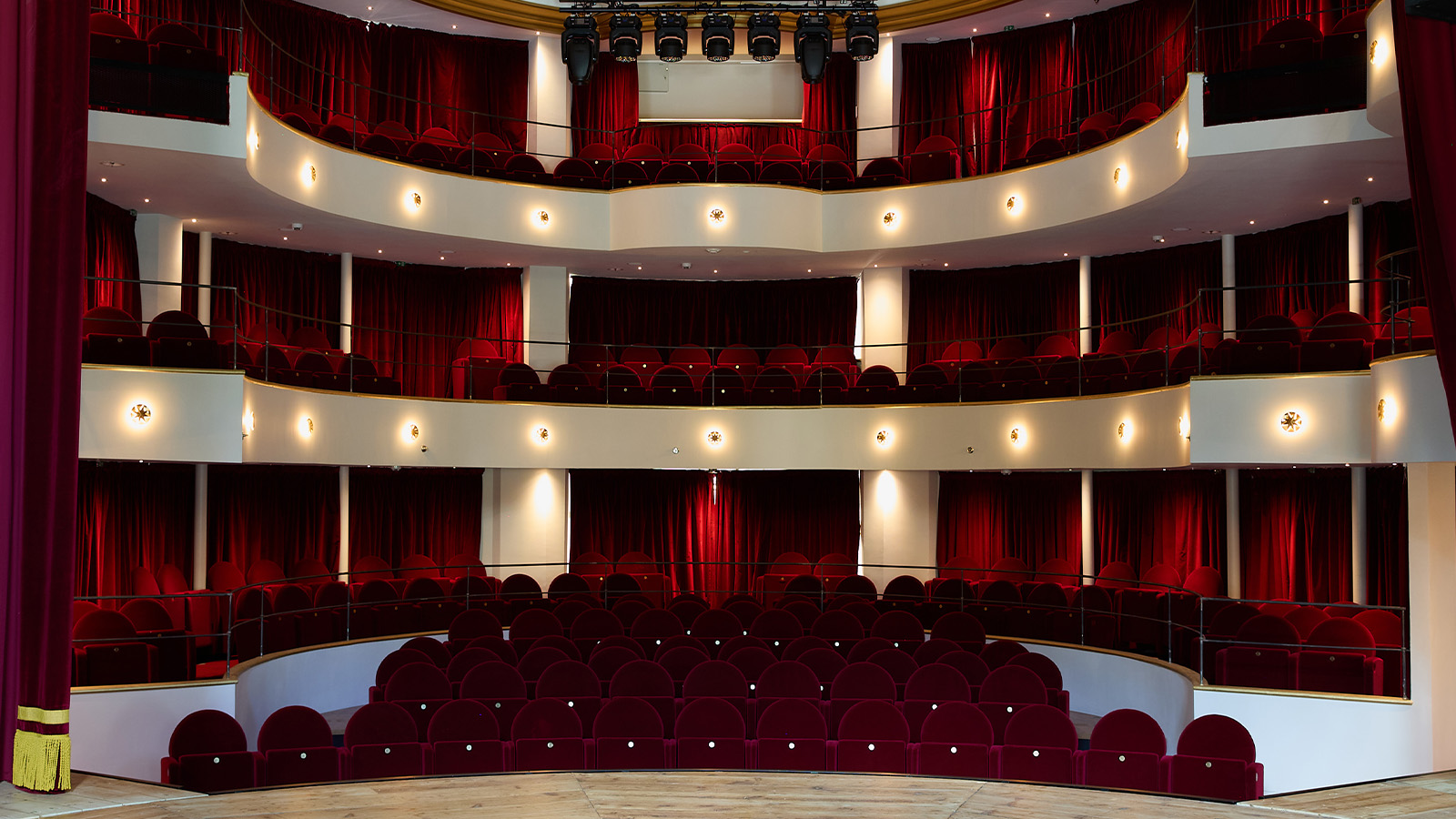 Teatro della Cometa, Rome, featuring red seating by Poltrona Frau