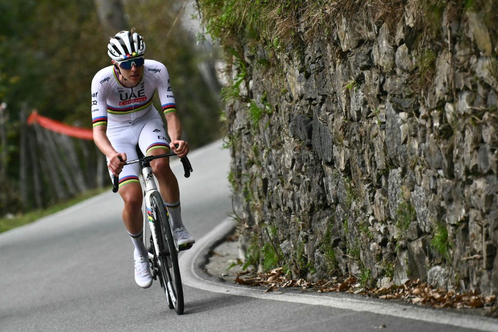 UAE Team Emirates team's Slovenian rider Tadej Pogacar attacks, to take the lead in a lone breakaway in the Colma Di Sormano ascent during the 118th edition of the Giro di Lombardia (Tour of Lombardy), a 252km cycling race from Bergamo to Como on October 12, 2024. (Photo by Marco BERTORELLO / AFP)