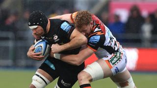 Tim Swinson of Saracens is held by Ollie Chessum during the Gallagher Premiership Rugby 