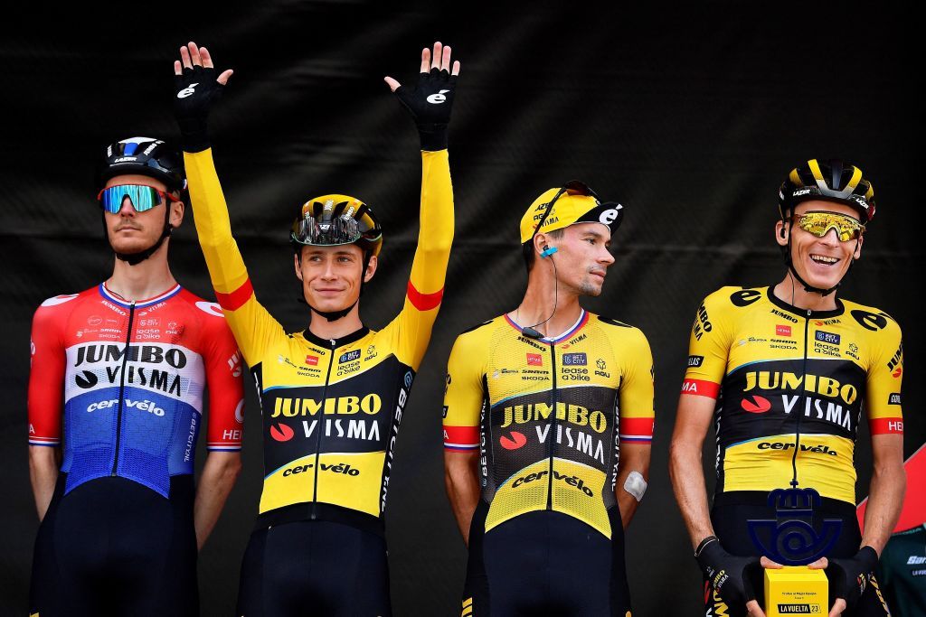 From L Team JumboVismas Dutch rider Dylan Van Baarle Team JumboVismas Danish rider Jonas Vingegaard Team JumboVismas Slovenian rider Primoz Roglic and Team JumboVismas Dutch rider Robert Gesink stand on stage ahead of the fourth stage of the 2023 La Vuelta cycling tour of Spain a 1846 km race from Andorra la Vella to Tarragona in Andorra on August 29 2023 Photo by Pau BARRENA AFP Photo by PAU BARRENAAFP via Getty Images