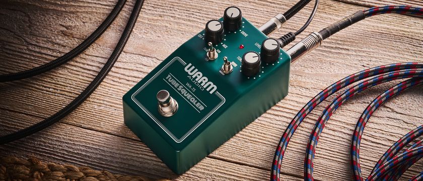 Warm Audio Tube Squealer green overdrive pedal shot on wood floorboards