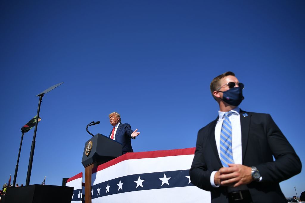 A secret service agent stands guard at a Trump rally in Prescott, Arizona