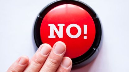 Someone pushes a red button that is labeled "No!"