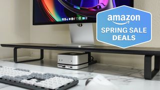 Satechi Mac Mini M4 Hub and Stand with keyboard on desk under Mac Studio Display with Amazon Spring Sale Deals badge