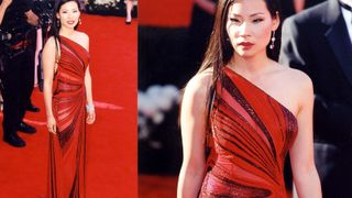 Lucy Liu wears a red one shoulder dress with sequin detailing